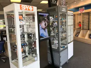 Display of designer eyewear brands inside Eye E Optical showroom.